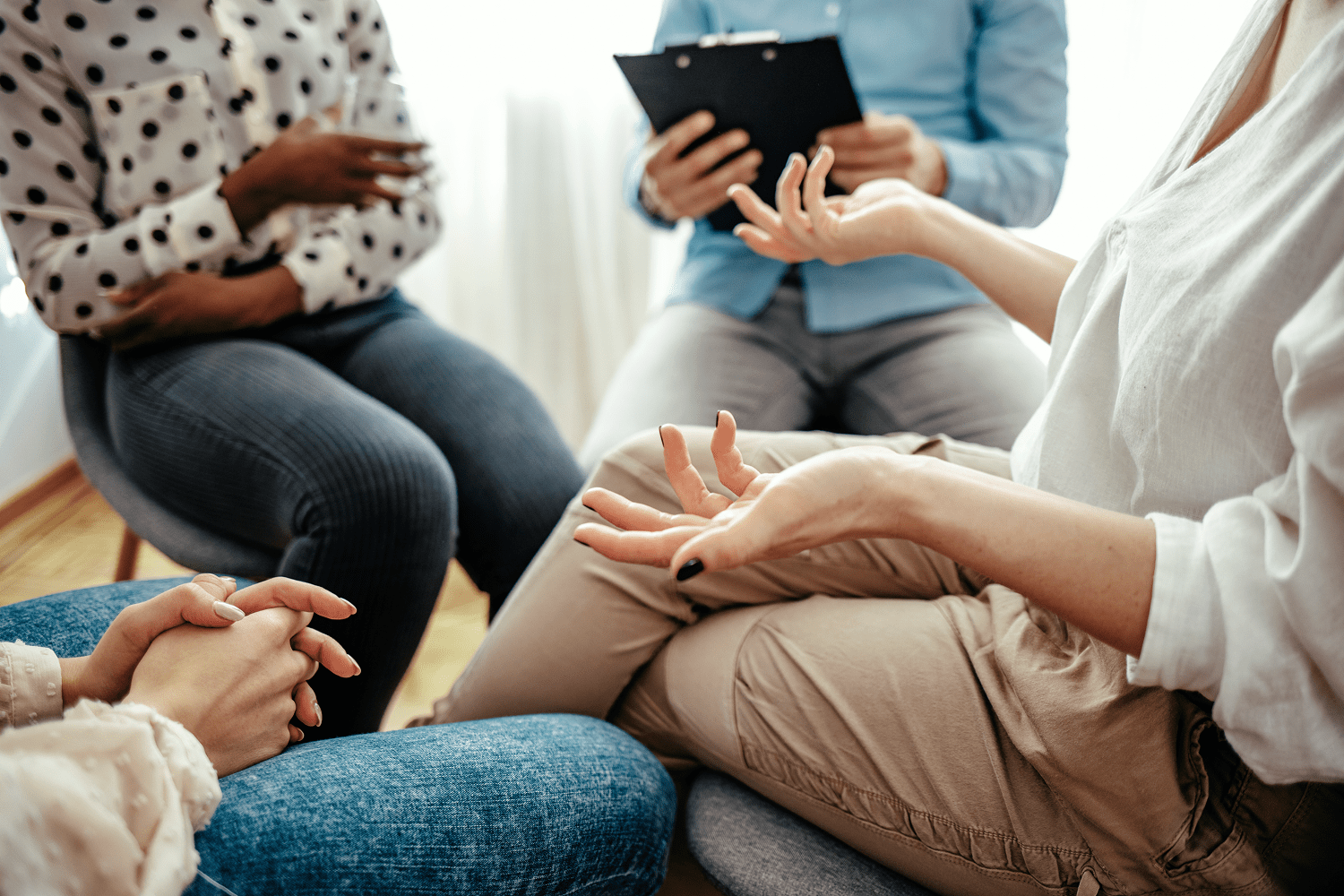 Group therapy session with people talking