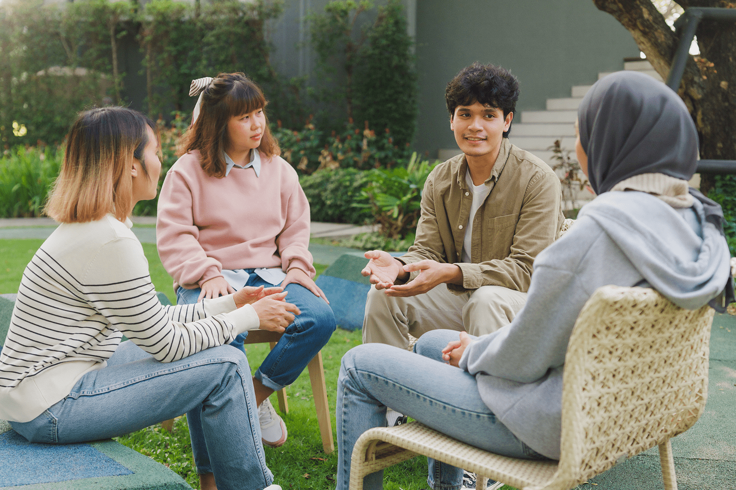 Young adults in outdoor group discussion