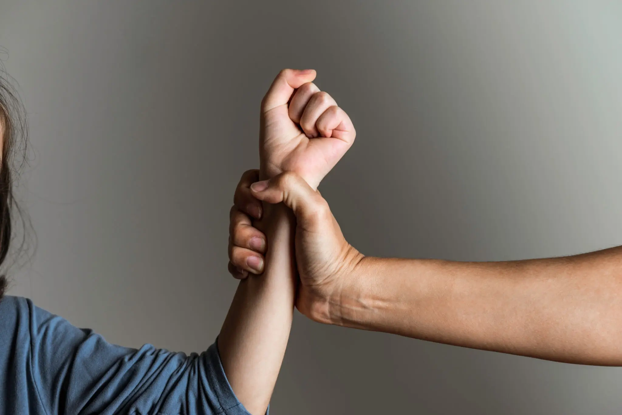 Adult grabbing child's wrist