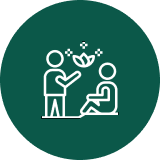 Caregiver offering flower to seated person