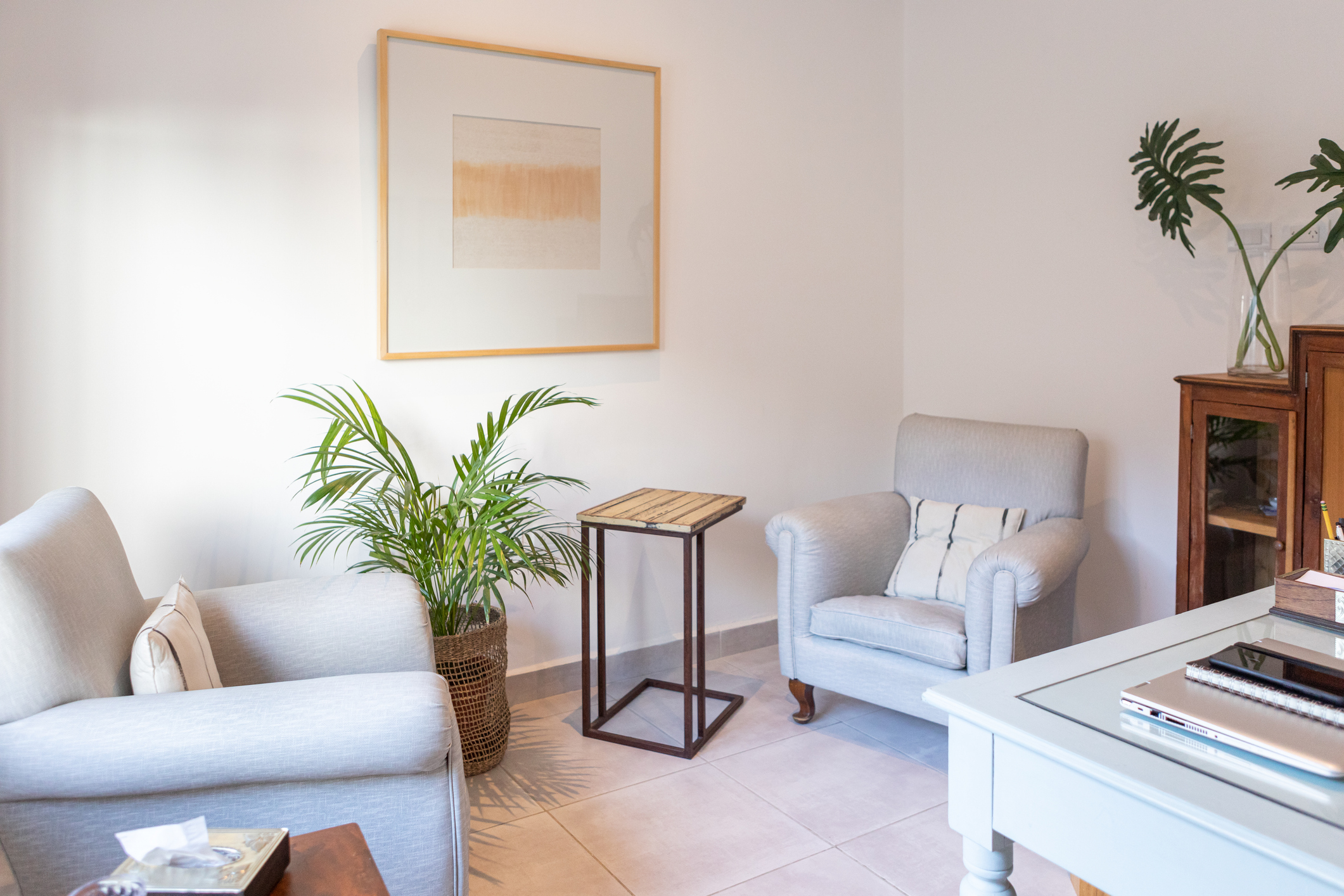 Bright living room with two armchairs
