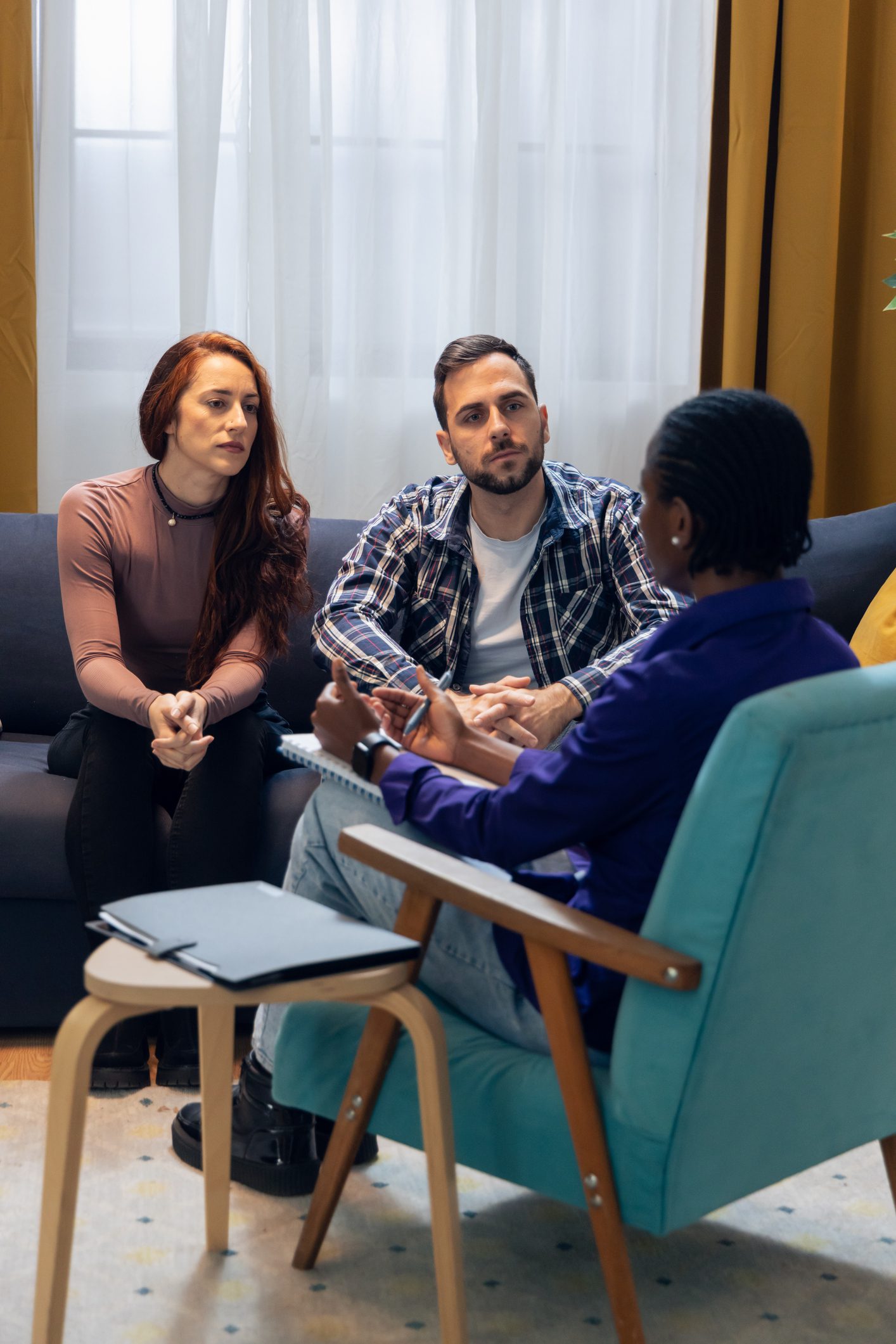 Couple in counseling session with therapist