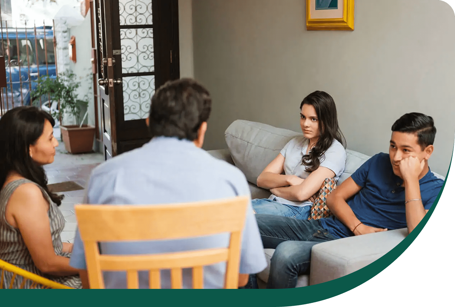 Family having tense conversation on couch