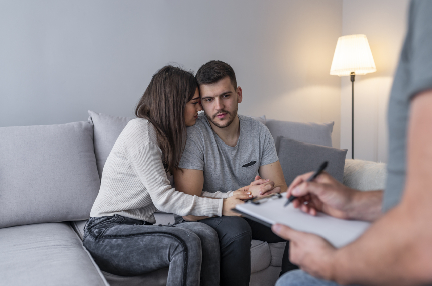 Couple in therapy session on couch