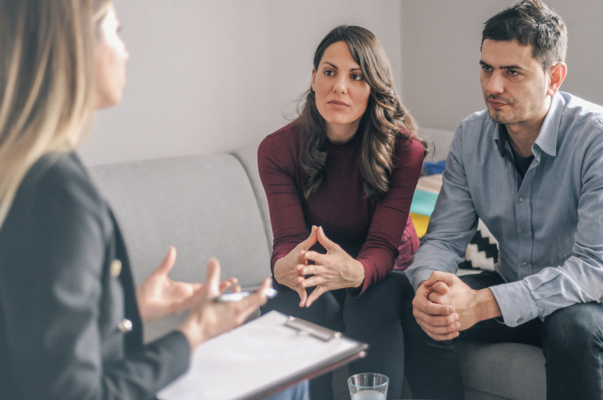 Couple in therapy session with counselor