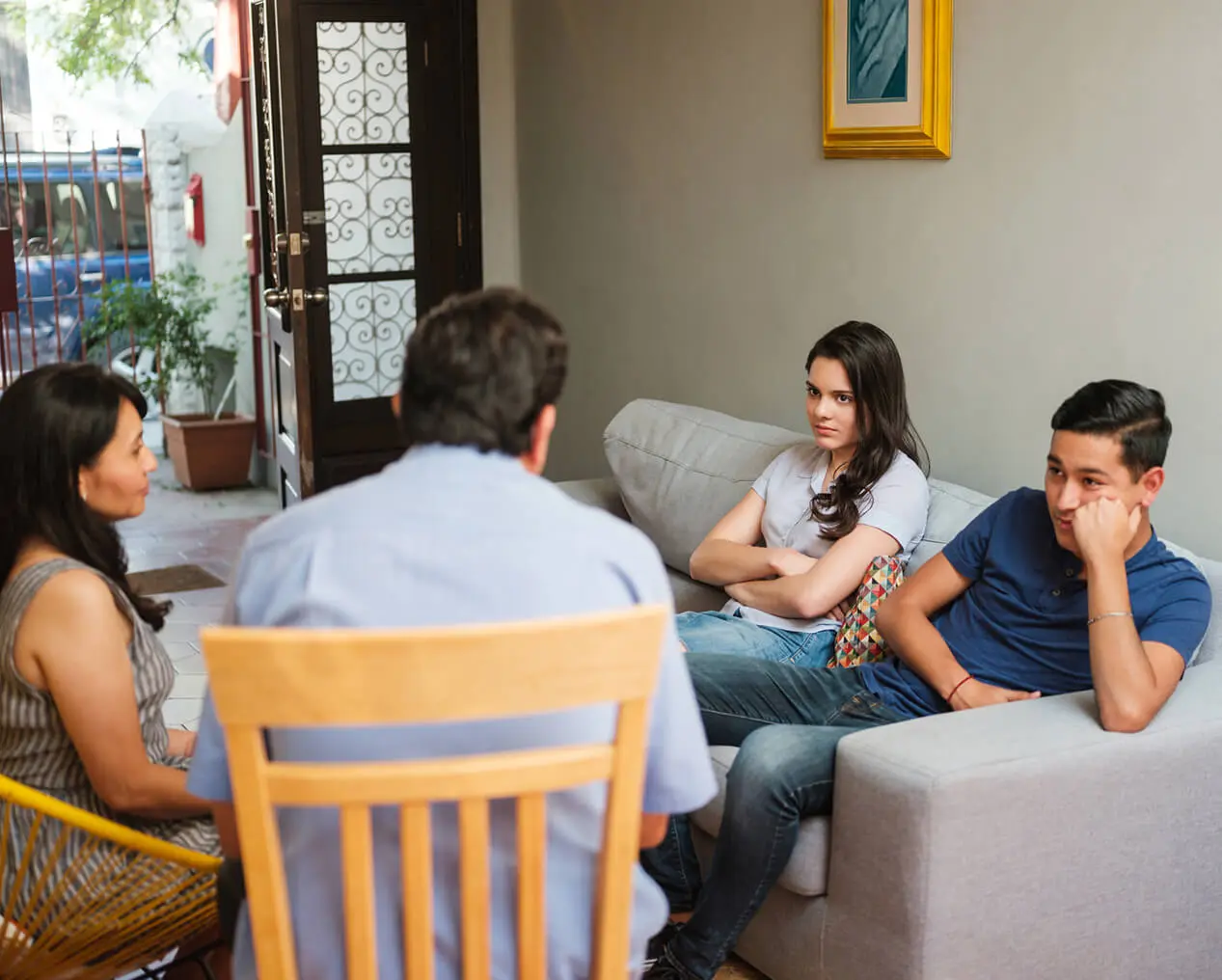 Family therapy session with two teenagers