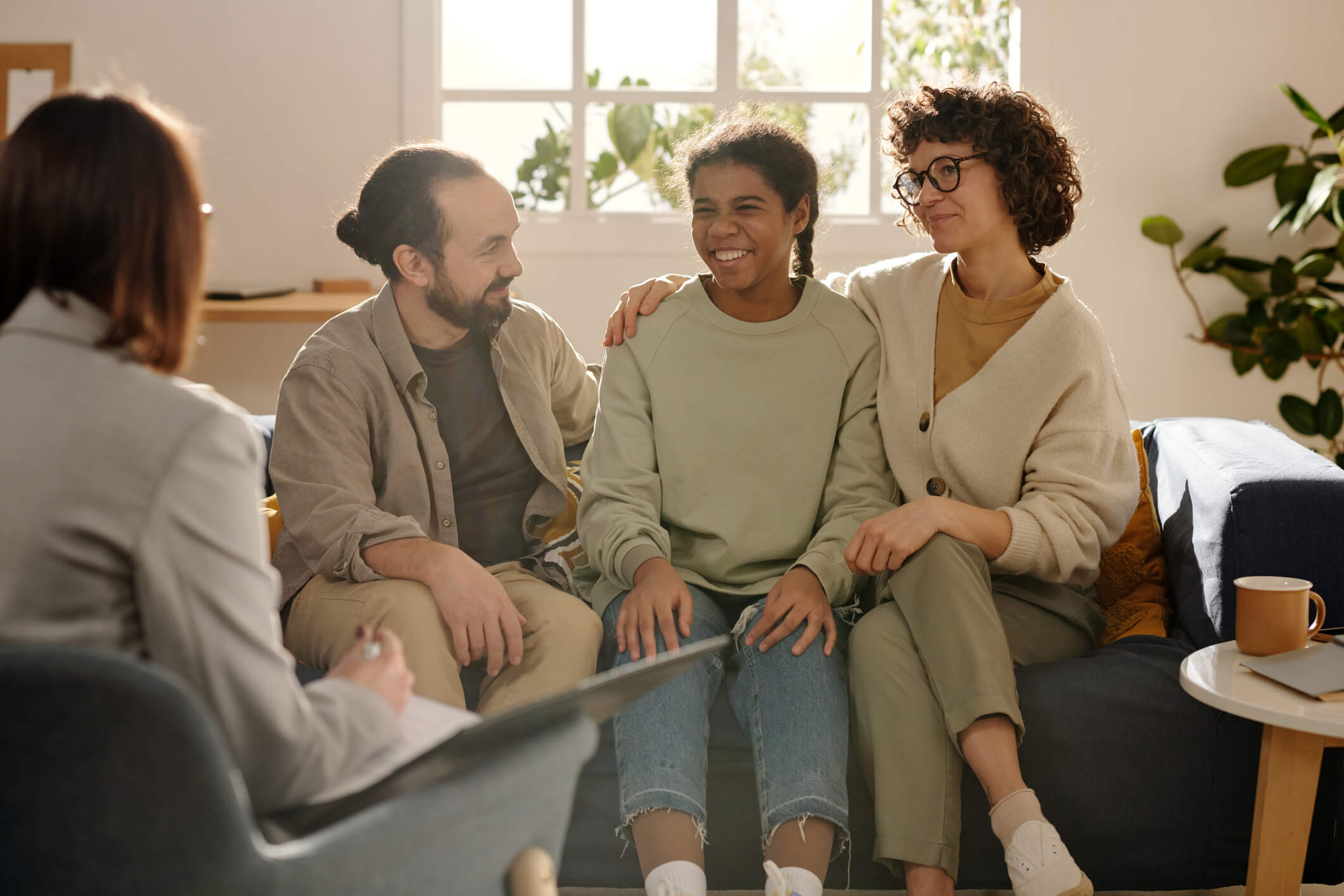 Family therapy session with smiling participants