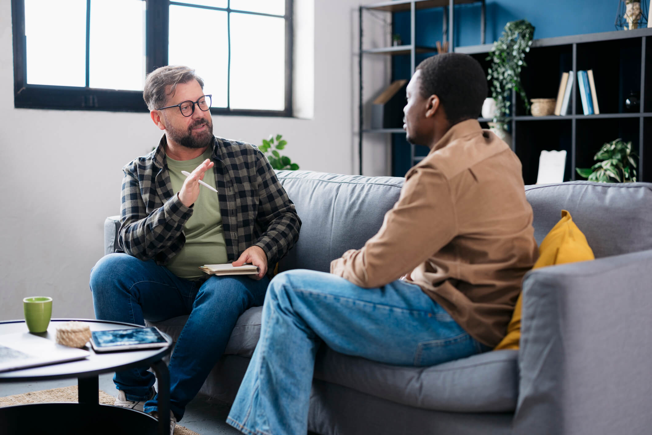 Therapist and client on couch therapy session