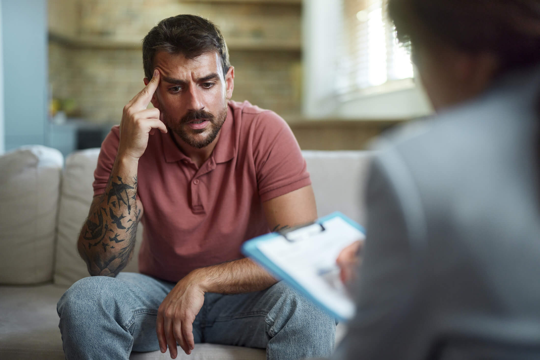 Distressed man in therapy session