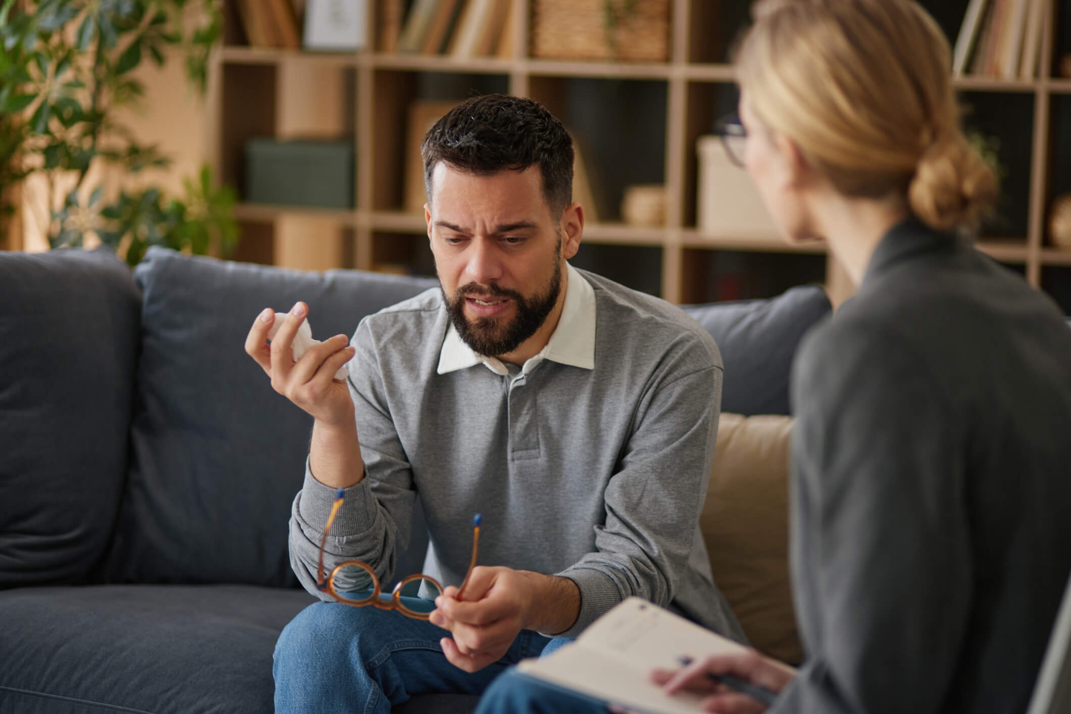 Frustrated man speaking with therapist